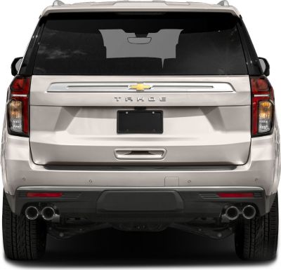 Rear view of an SUV with quad exhaust tips and distinctive taillights