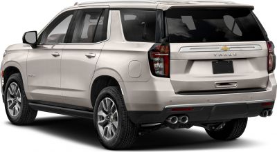 Rear side view of SUV with quad exhaust and tinted windows