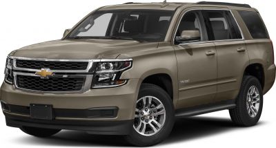Front three-quarter view of beige SUV with chrome grille and alloy wheels