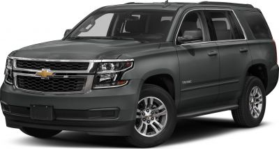 Front side view of SUV with prominent grille, headlights, and alloy wheels