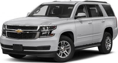 Front-side view of SUV with chrome grille and distinctive headlights
