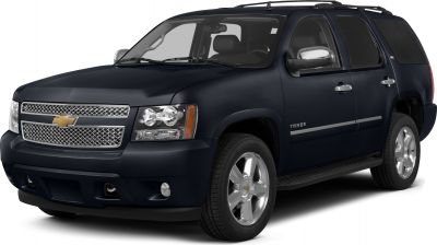 Front side view of SUV with detailed grille and headlamps