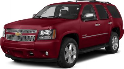 Front and side profile of a red SUV with chrome grille and alloy wheels