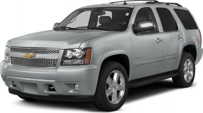 Front side exterior view of silver SUV with grille, headlights, and alloy wheels