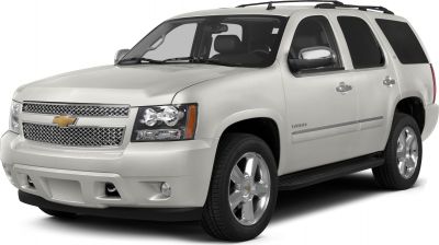 Front-side view of SUV with chrome grille and dual headlights