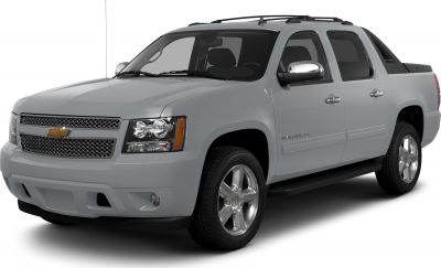 Pickup truck with crew cab, roof rack, and alloy wheels.