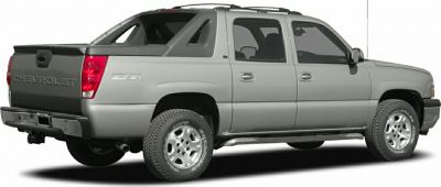 Four-door pickup truck with rugged bed and off-road tires side profile