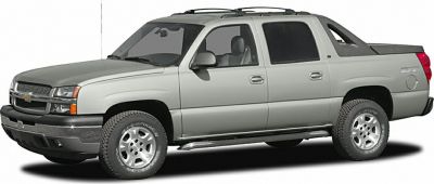 Silver pickup truck with crew cab and covered cargo bed
