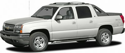 Side profile of a four-door crew cab pickup with integrated bed and off-road tires