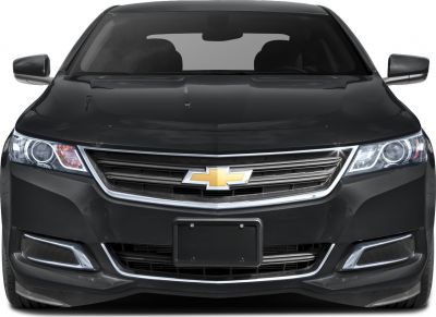 Close-up of a vehicle's grille, headlights, and front design
