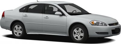 Silver 4-door sedan with alloy wheels and distinct headlights