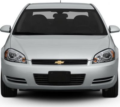 Dual headlights and prominent front grille of a sedan