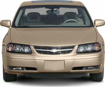 Front view with dual headlights and chrome grille