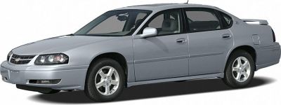Silver mid-size sedan with alloy wheels and rear spoiler