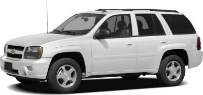 White mid-size SUV with roof rails and five-spoke wheels.
