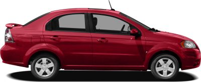 Side profile of red sedan with rear spoiler and alloy wheels