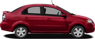 Side profile of a red sedan with rear spoiler and alloy wheels