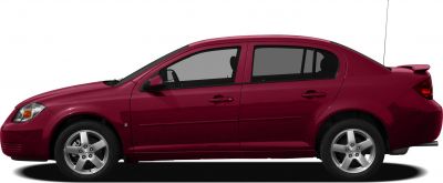 Side profile of red sedan with alloy wheels and rear spoiler