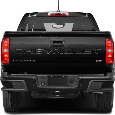 Rear view of pickup with tailgate, taillights, V6 badge