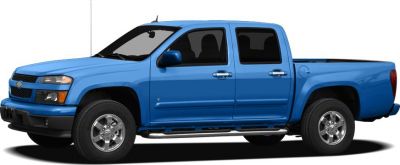 Blue crew cab pickup truck with chrome wheels and black step bars side view