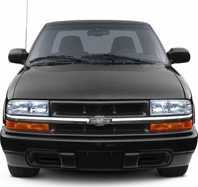 Front view with dual headlights and horizontal grille with emblem