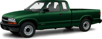 Green extended cab pickup with steel wheels, side profile view.