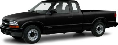 Black extended cab pickup with steel wheels in side profile