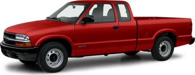 Red extended cab pickup truck with black trim and steel wheels