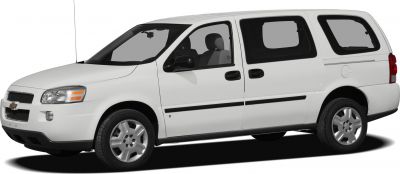 Side view of a white minivan with sliding doors and extended body