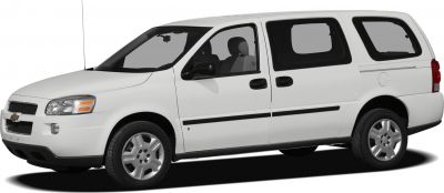 Side view of white multi-purpose vehicle with extended wheelbase and tinted rear windows
