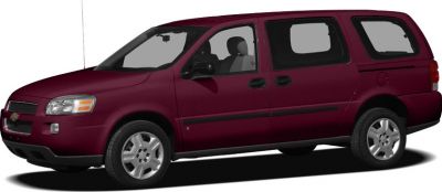Minivan side profile with sliding rear doors and alloy wheels.