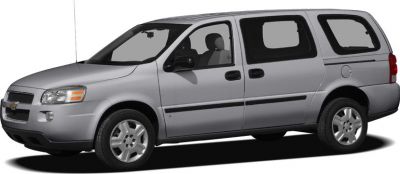 Silver minivan side view with sliding door and alloy wheels