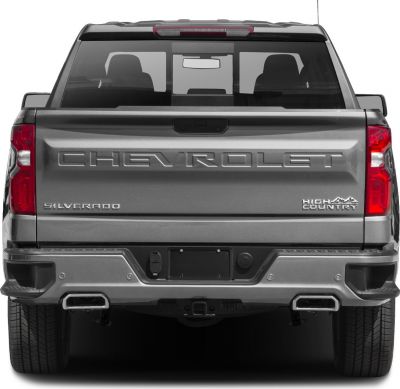 Rear view of Silverado 1500 IV Crew Cab with High Country badge and dual exhaust.