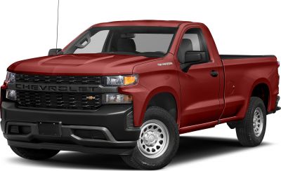Red pickup truck front view with steel wheels and black grille