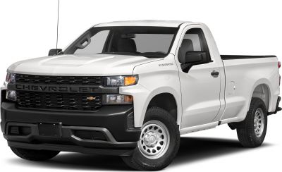 Front-side view of pickup with bold grille and extended cargo bed