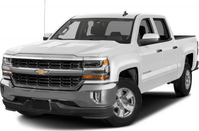 Front and side view of a white double cab pickup truck with a prominent grille and standard cargo box.