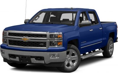 Blue pickup truck front-side view with chrome grille and crew cab