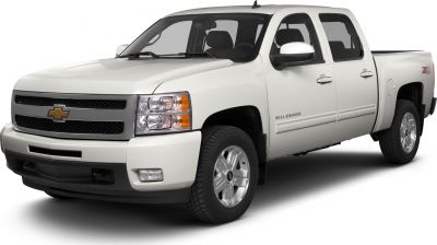 Front view of white crew cab pickup with grille and headlights
