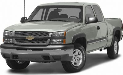 Front and side view of a light gray pickup truck with crew cab and dual headlights