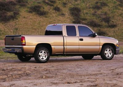Side view of extended cab pickup with four doors and truck bed