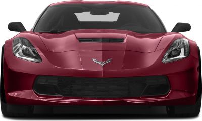 Front view showing sleek headlights and hood vent