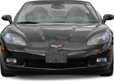Front view of a black convertible with distinctive headlights and emblem