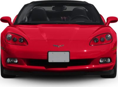 Front view of a red sports coupe with dual headlights and sleek aerodynamic shape