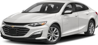 Front grille and sleek headlight design of white sedan