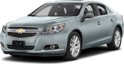Front three-quarter view of a mid-size sedan with chrome grille and modern headlights