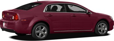 Side view of a four-door sedan with circular rear lights and chrome window trim