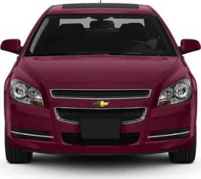 Front view of a red sedan with grille, headlights, and sunroof