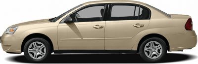 Side profile of beige mid-size sedan with alloy wheels