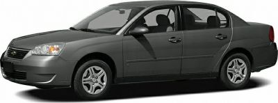 Side profile of a four-door sedan with wheels and door details