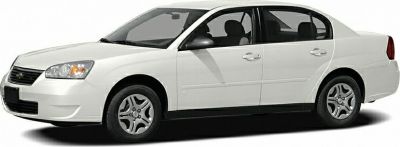 White sedan with side profile and alloy wheels